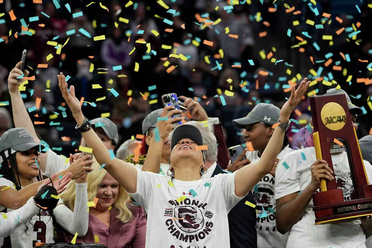 FILE - South Carolina head coach Dawn Staley celebrates after a college basketball game during the final round of the Women's Final Four NCAA tournament against UConn in Minneapolis on Sunday, April 3, 2022. NCAA Women The basketball title game will air on ABC for the first time this season. The championship game, which normally airs in prime time, will take place at 3:00 PM ET. This year's Final Four will be held in Dallas.  (AP Photo/Eric Gay, File)