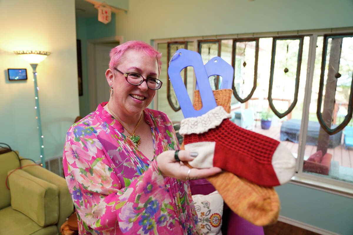 Wendy Moreland shows off a pair of socks she designed that feature male and female genitalia subtly woven into the pattern. The San Antonio knitting instructor also does her share of NSFW cross stitch and knitting designs.