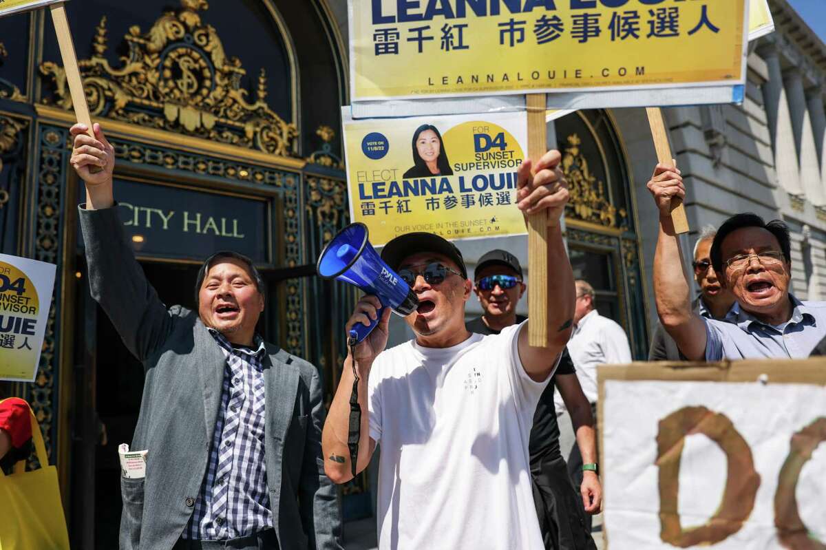 Leanna Louie supporters cheer after her news conference to announce the filing of a lawsuit against the city of San Francisco for barring her from running as a candidate for District Four supervisor.