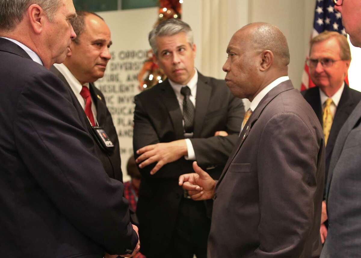 Houston Mayor Sylvester Turner speaks with members of the police pension system after announcing a reform plan in 2016. On Tuesday, a state appeals court upheld part of the package after a challenge by the firefighters’ pension board.