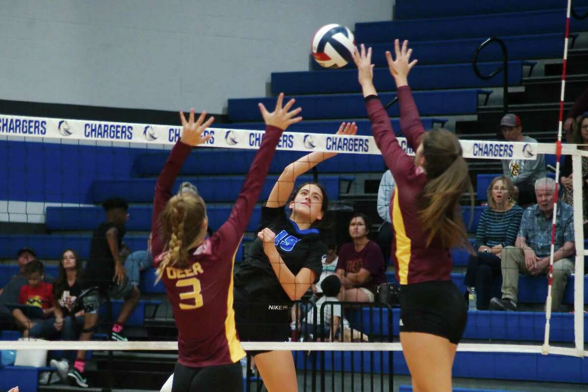 Clear Springs’ Anzley Rinard (19) tries to hit a shot past Deer Park’s Kailey Sexton (3) and Deer Park’s Cayley Hanson (24) Tuesday, Aug. 30, 2022 at Clear Springs High School.