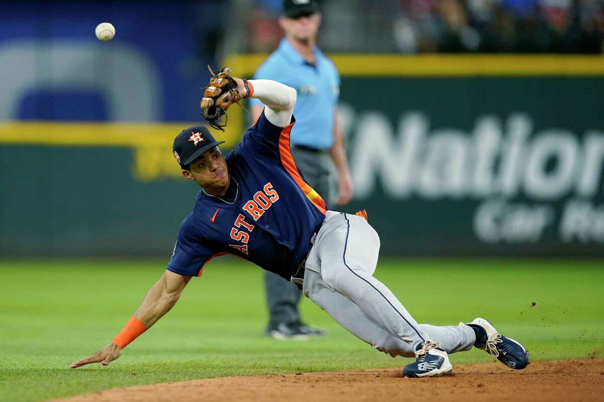 Houston Astros shortstop Jeremy Pena is unable to field a single hit by Texas Rangers' Adolis Garcia during the sixth inning of a baseball game in Arlington, Texas, Tuesday, Aug. 30, 2022. (AP Photo/Tony Gutierrez)