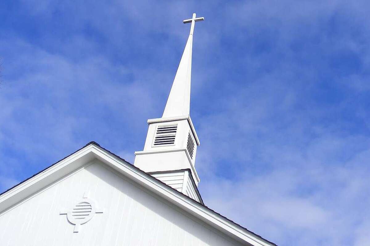 A church steeple is pictured in this stock photo.