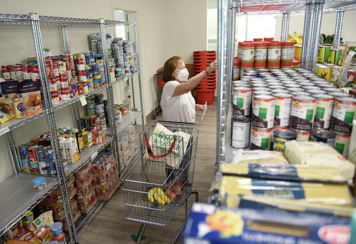 Greenwich resident Marleny Jimenez shops at the new Neighbor to Neighbor food pantry in Greenwich, Conn. Tuesday, Aug. 30, 2022. The new 6,300-square-foot Cohen Center for Neighbor to Neighbor located on the campus of Christ Church Greenwich opened its doors to clients on Monday.