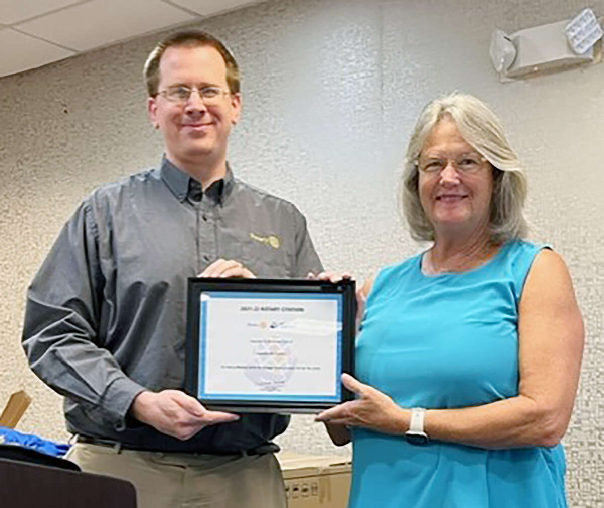 Jane Becker (right), Jacksonville Sunrise Rotary past president, receives a Rotary Citation certificate from Ryan Byers, immediate past district governor, during the club’s Aug. 30 meeting. The citation recognizes a club’s ability to meet goals outlined by Rotary International.