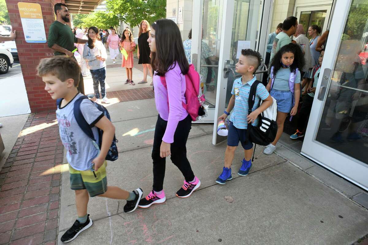 Students leave after the first day of school at McKinley Elementary School, in Fairfield, Conn. Aug. 29, 2022.