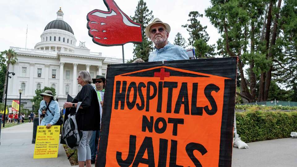 Bob Britton rallies with supporters of Gov. Gavin Newsom’s CARE Court plan that aims to get severely mentally ill people into treatment on Aug. 1, 2022 in Sacramento. Lawmakers approved the bill to implement the system on Wednesday.