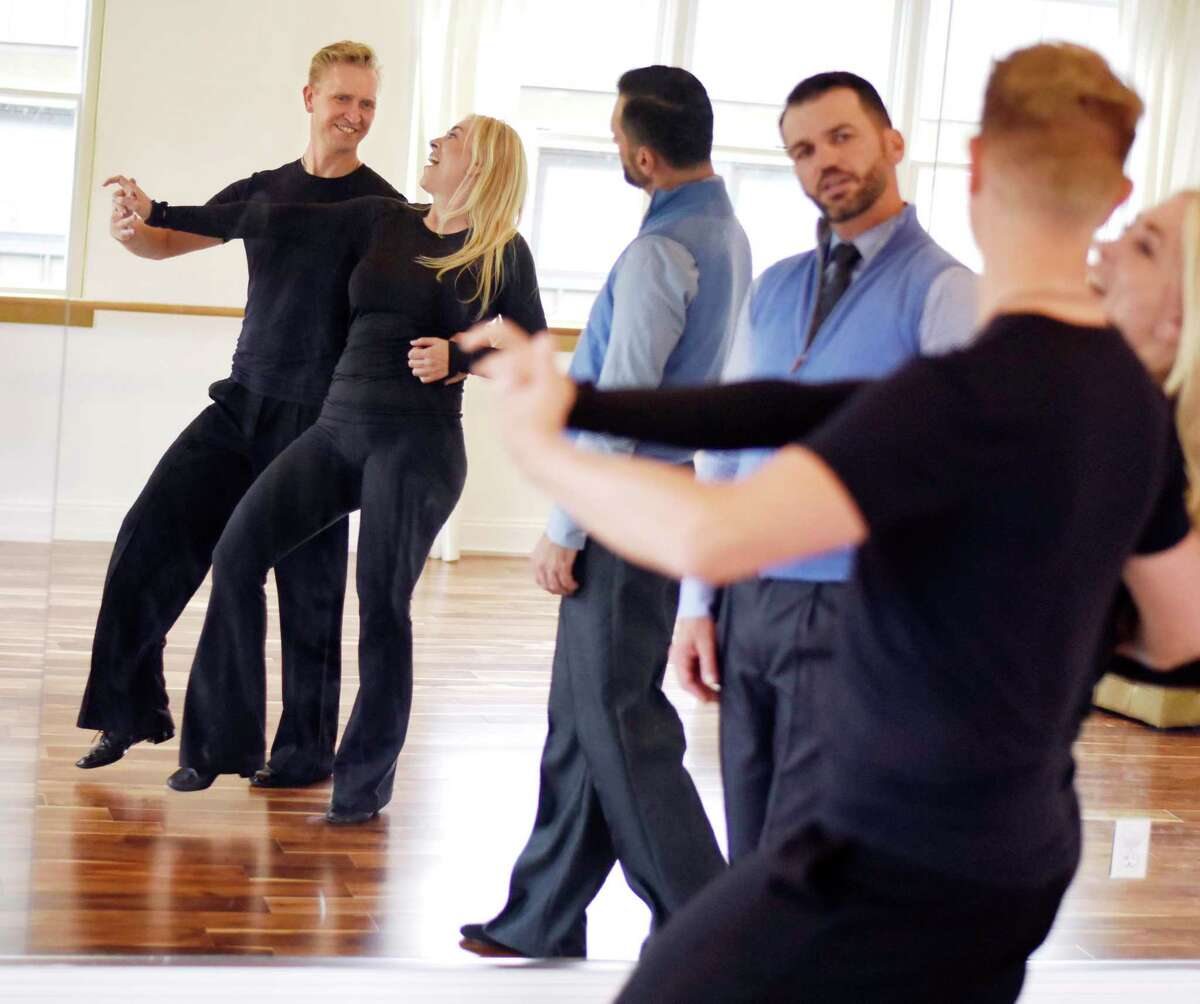 Dancing with the Stars champion Tony Dovolani watches as Astaire studio co-owner Elmar Schmidt and Greenwich actress Afton Fraser practice their routine for the 2019 Dancing Stars of Greenwich at Fred Astaire Dance Studio in Greenwich. Both Schmidt and Fraser will once again take part in the 2022 charity dance-off gala for Abilis.