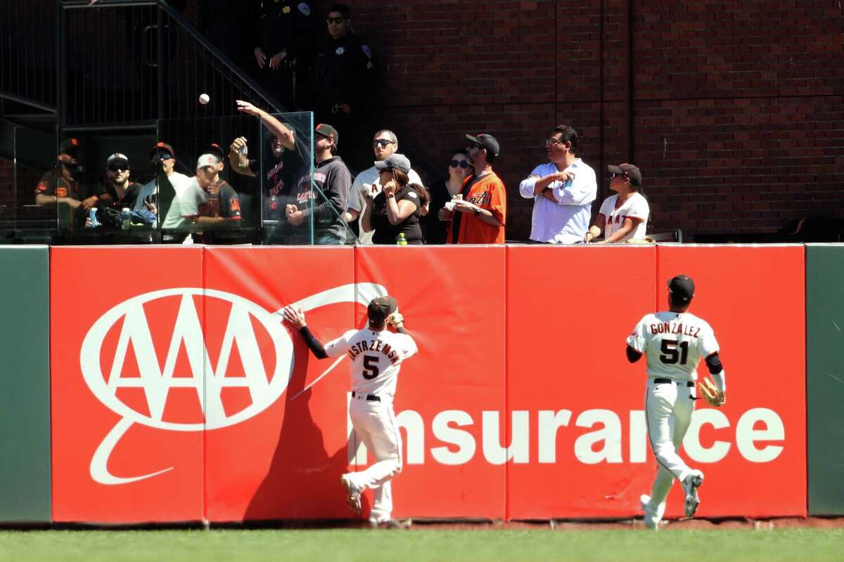 San Francisco Giants’ Mike Yastrzemski and Luis Gonzalez can’t get to a ground rule double by San Diego Padres’ Manny Machado in 5th inning during MLB game at Oracle Park in San Francisco, Calif., on Wednesday, August 31, 2022.