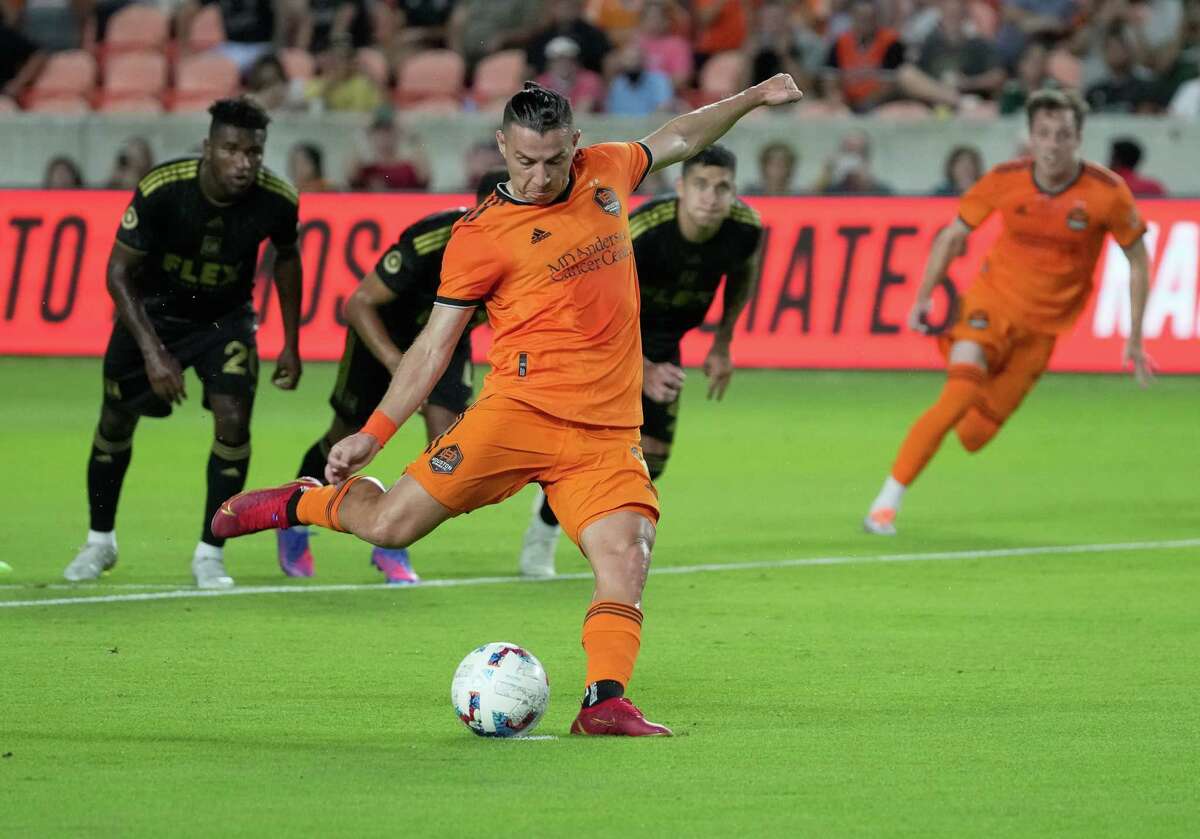 Houston Dynamo forward Sebastián Ferreira (9) takes a penalty kick and scores during the first half of a MLS game against the Los Angeles FC Wednesday, Aug. 31, 2022, at PNC Stadium in Houston.