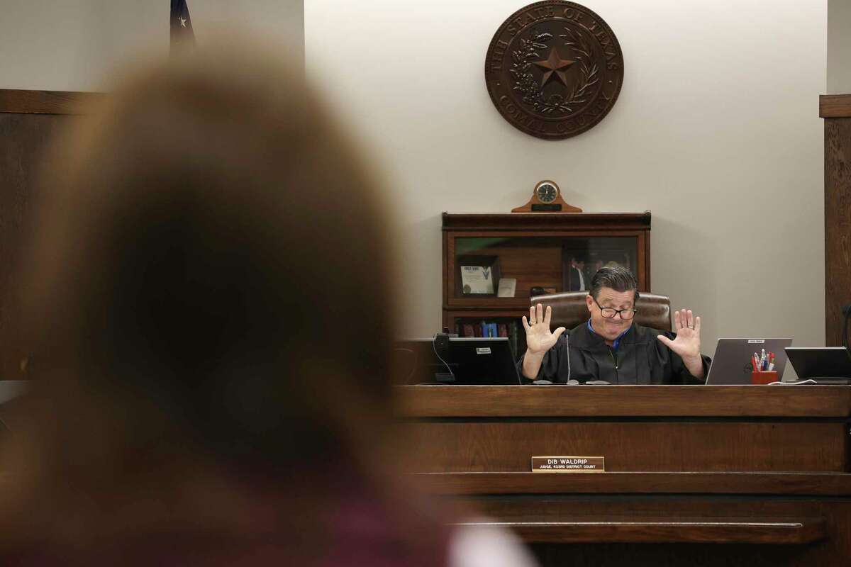 Comal County District Court Judge Dib Waldrip reacts while speaking with Elizabeth Weston during an Aug. 26 pre-trial hearing in her divorce from Rackpsace co-founder Graham Weston.