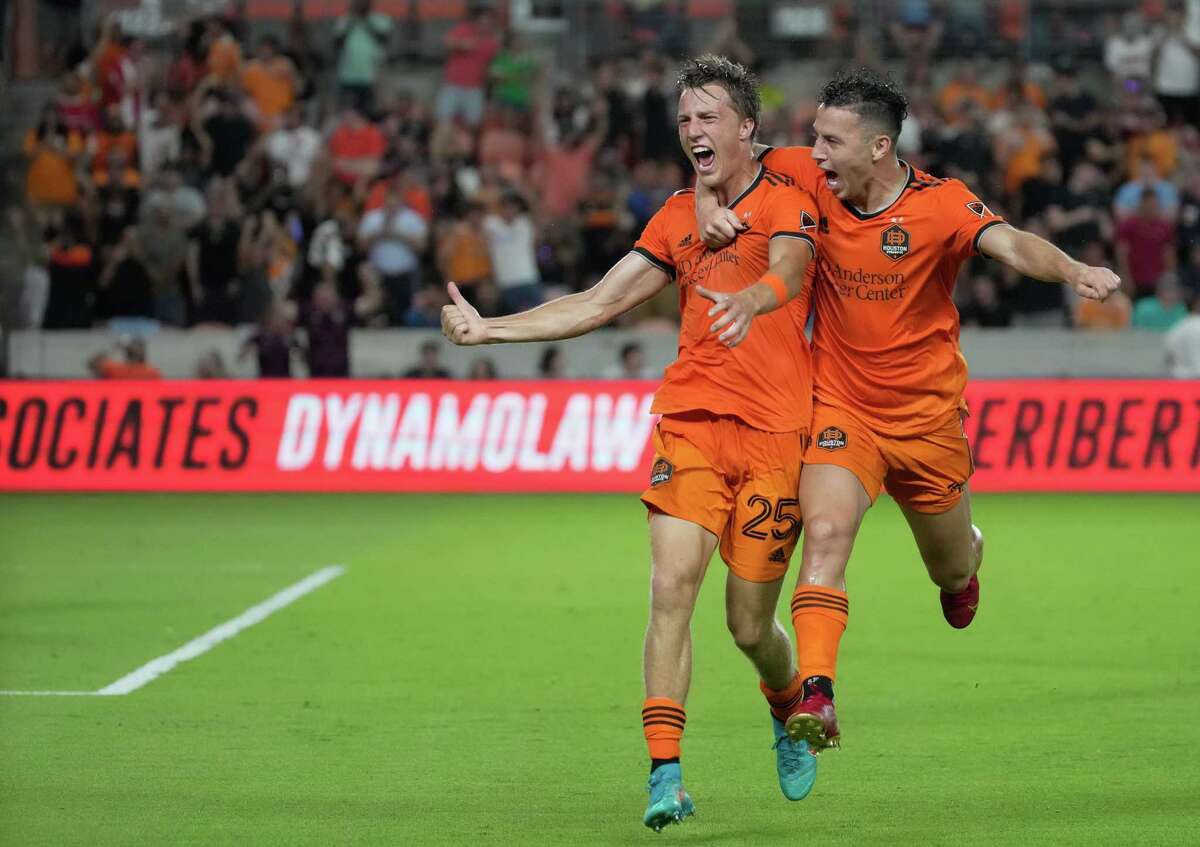 Houston Dynamo forward Sebastián Ferreira (9) celebrates with Griffin Dorsey (25) after Dorsey scored the game-winning goal during the second half of a MLS game against the Los Angeles FC Wednesday, Aug. 31, 2022, at PNC Stadium in Houston. Houston Dynamo defeated Los Angeles FC 2-1.