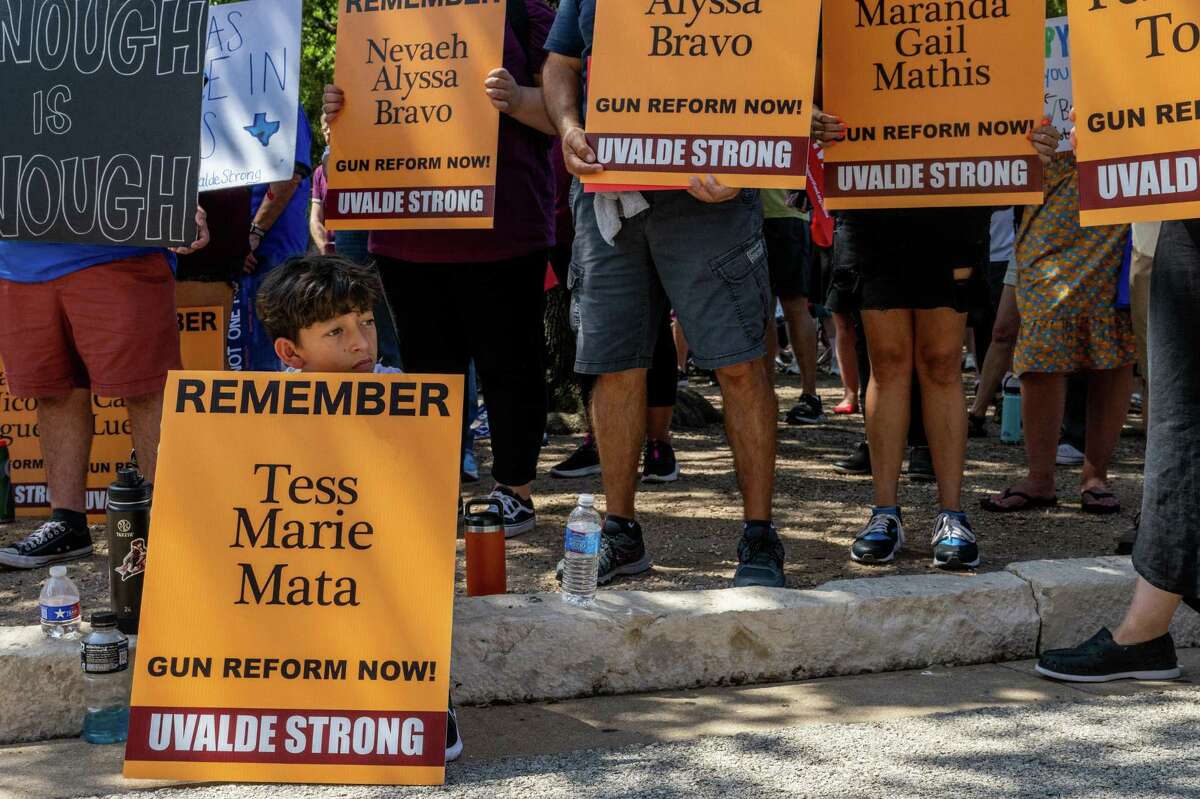 AUSTIN, TEXAS - AUGUST 27: Miguel Ortiz, 11, sits listening during a rally held for the 19 children and 2 teachers who were murdered during the mass shooting at Robb Elementary School, during a March For Our Lives demonstration, on August 27, 2022 in Austin, Texas. "Its been very difficult for us to go back to school in San Antonio. As a mom, I literally take a picture of him everyday because I might not remember what he was wearing... We wrote letters to the survivor children and in one of his letters he wrote "Its hard to go to school and think you might not come home," and that's why we're here-that's why we're here," said Miguel's mom Sandra. 'March For Our Lives' and activists rallied with parents from Uvalde and Santa Fe at the Texas Capitol, where they demanded that Gov. Greg Abbott calls a special session to raise the minimum age to 21 for the purchase of assault weapons. (Photo by Brandon Bell/Getty Images)