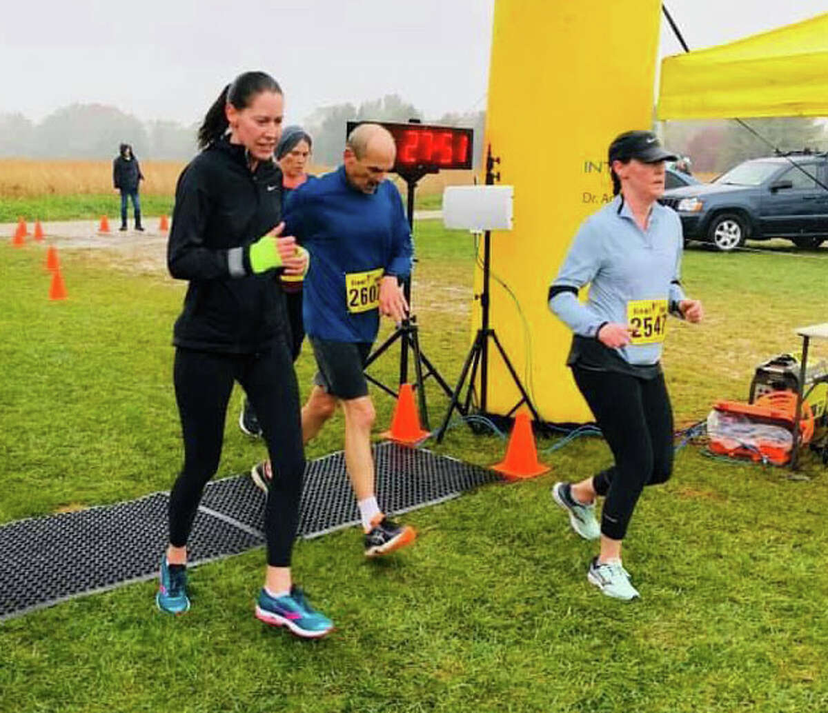Runners compete in a previous version of the Golden Apple 5K at Liberty Apple Orchard in Edwardsville. This year’s race will be held on Sept. 24 and will benefit pediatric cancer research and services through the American Cancer Society.