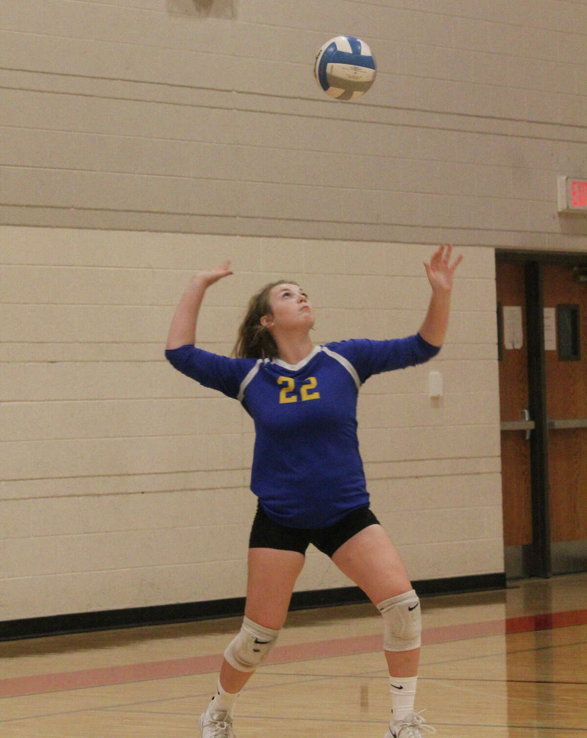 Evart's  Brooklyn Decker gets ready to serve on Saturday at the Reed City Invitational.
