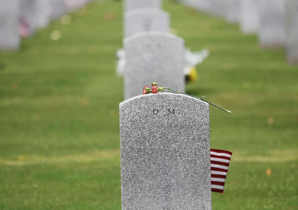 Volunteers will help with clean up efforts at the Houston National Cemetery on Sept. 10, 2022, as part of the September 11 National Day of Service. Shown here are flowers left on a gravesite following the Memorial Day Ceremony at the Houston National Cemetery on Monday, May 27, 2019.