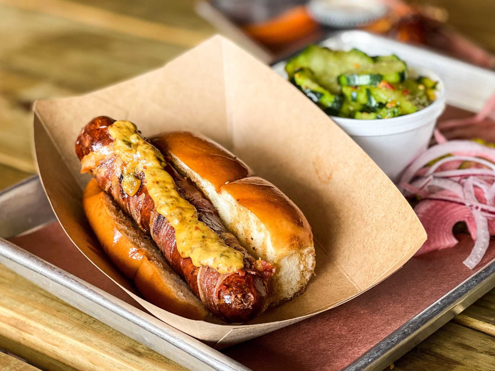 Hot dogs are finding a home on Texas barbecue-joint menus