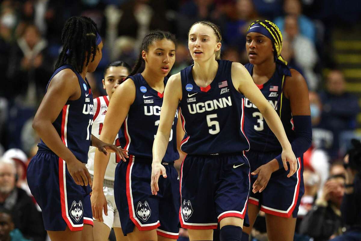 BRIDGEPORT, CONNECTICUT - MARCH 28: Paige Bueckers #5 of the UConn Huskies reacts after a play during the first half against the NC State Wolfpack in the NCAA Women's Basketball Tournament Elite 8 Round at Total Mortgage Arena on March 28, 2022 in Bridgeport, Connecticut. (Photo by Elsa/Getty Images)