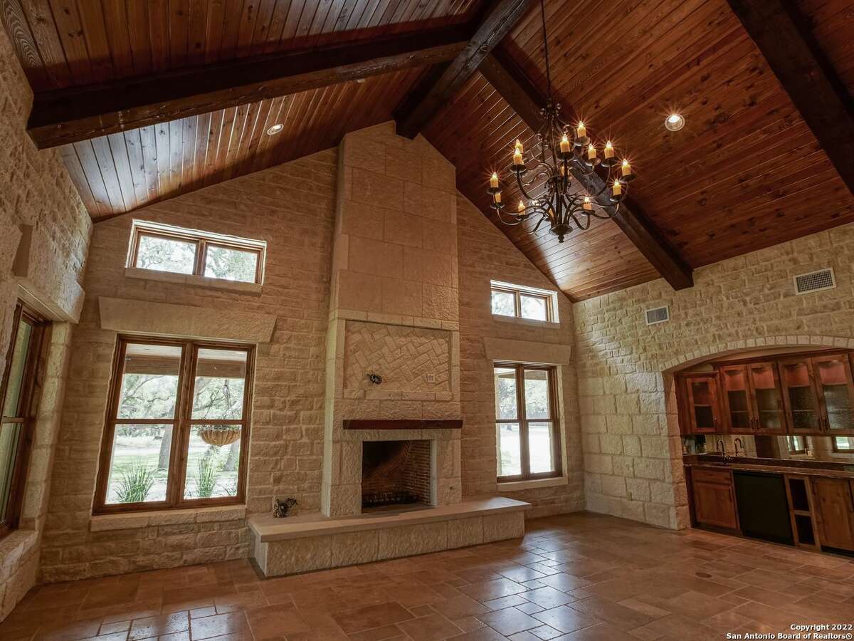 The property oat 35 Old San Antonio Rd. sits on 14.1 acres and includes two homes — one of which is a renovated 1890s era structure. The other is a 5,353-square-foot home with interior rock walls, four bedrooms, three full bathrooms and two partial bathrooms.