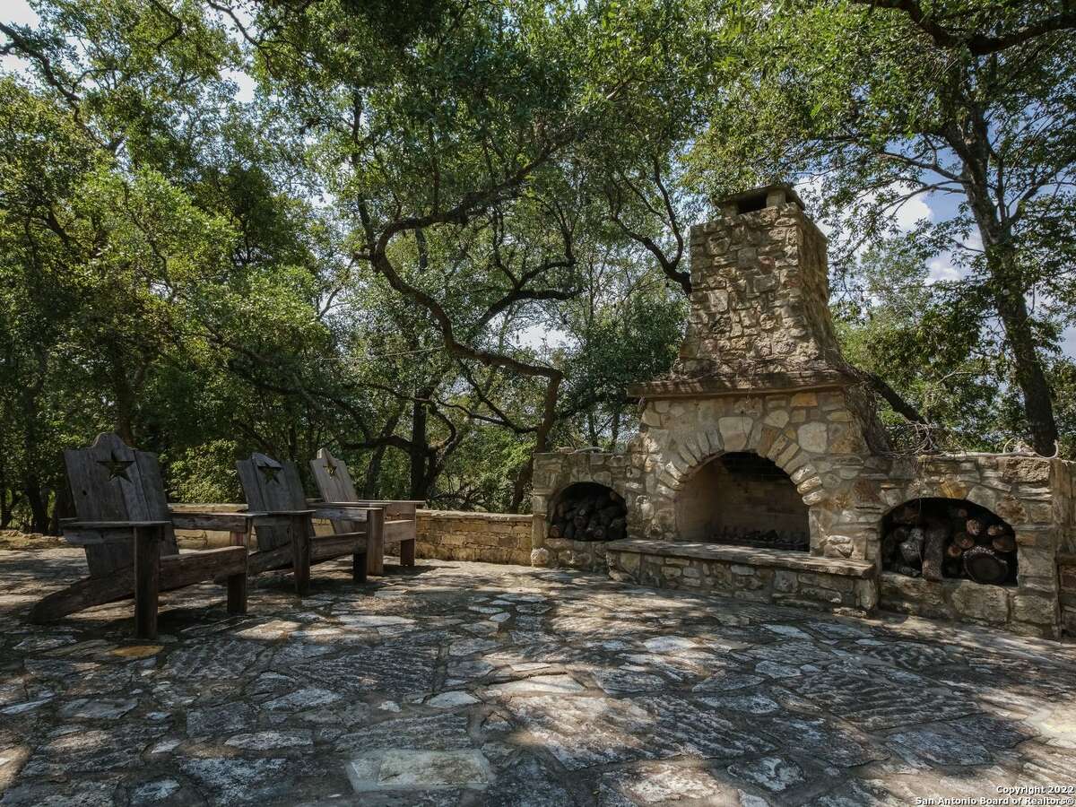 The property oat 35 Old San Antonio Rd. sits on 14.1 acres and includes two homes — one of which is a renovated 1890s era structure. The other is a 5,353-square-foot home with interior rock walls, four bedrooms, three full bathrooms and two partial bathrooms.