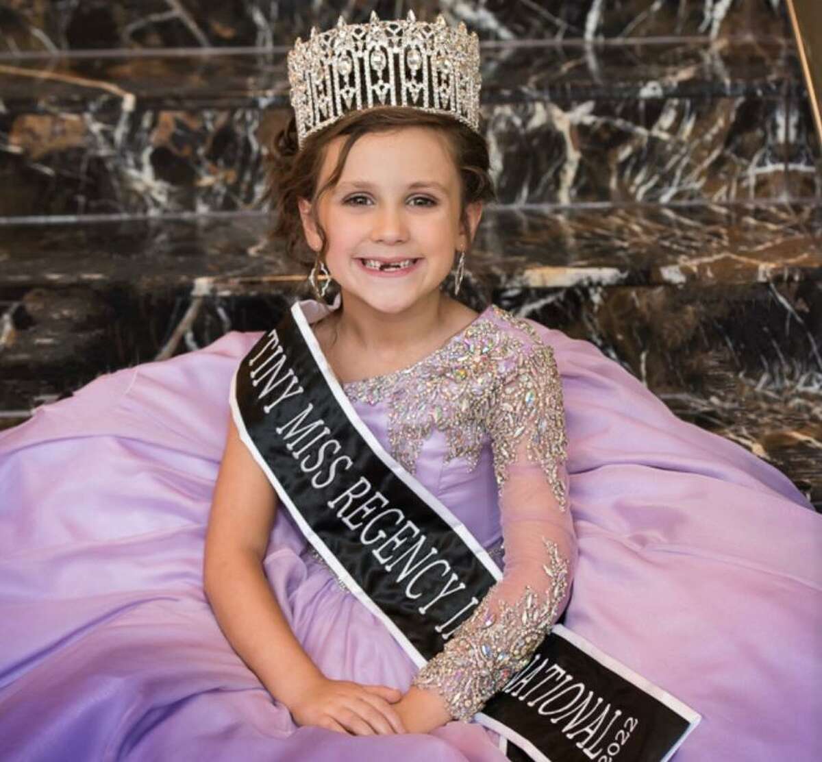Makynlee Thomas, 5, is pictured just after winning the title of Tiny Miss Regency International in Las Vegas, Nevada. Makynlee has won numerous titles and awards and uses her queen status to help others through community service.
