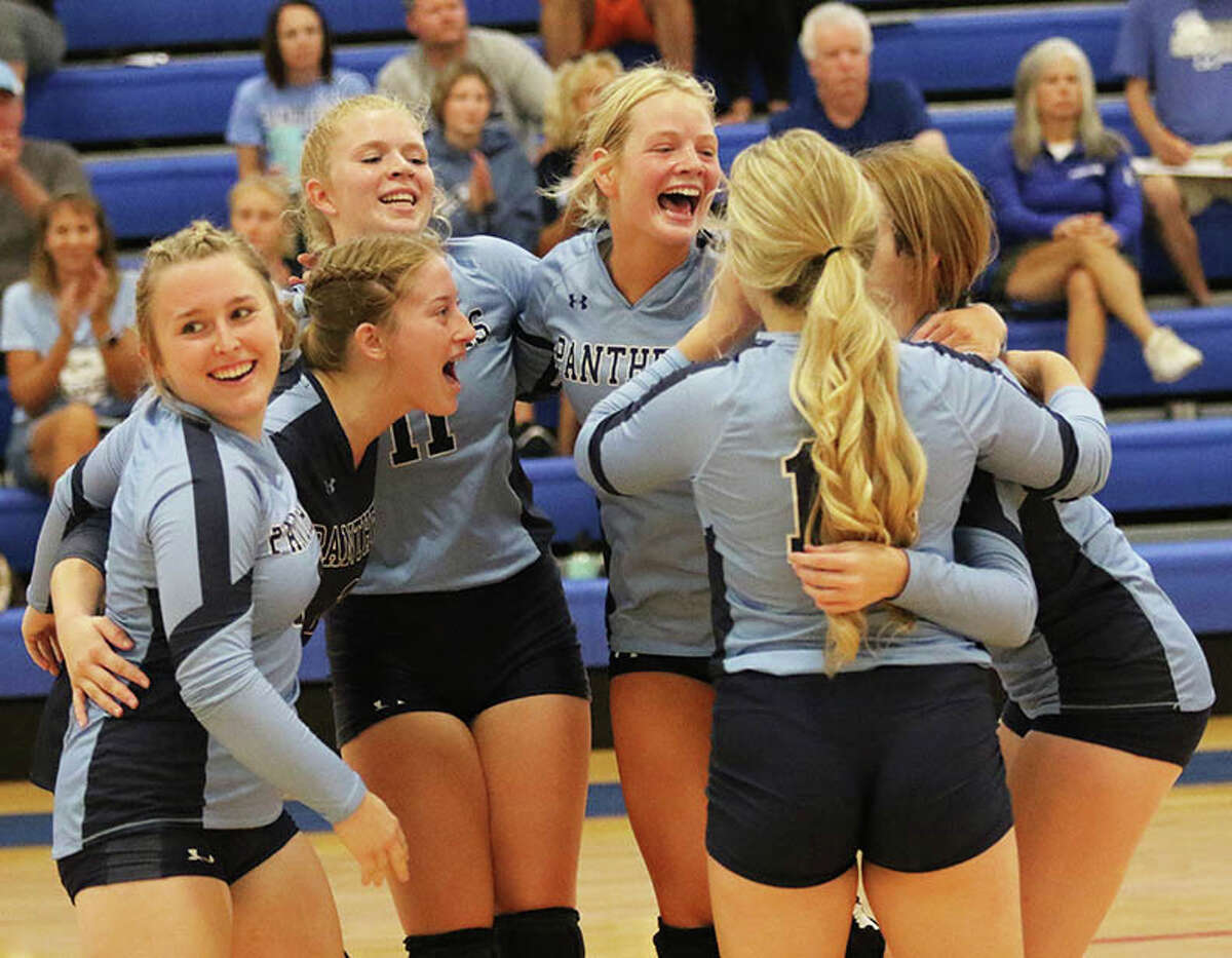 The Jersey Panthers, shown celebrating a point during a win at the Roxana Tourney earlier this season, improved to 5-2 Thursday with a three-set win at Greenfield. 