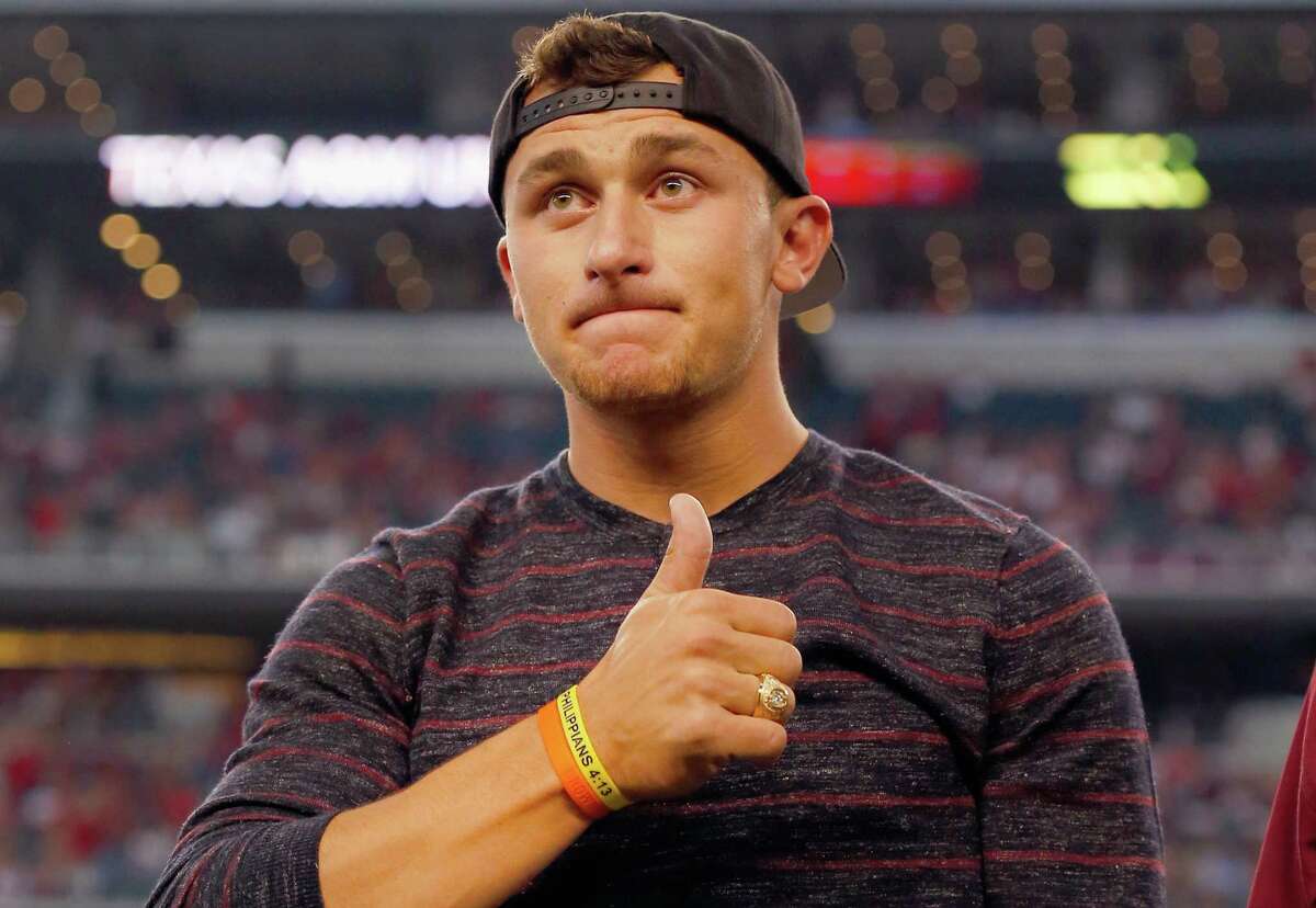 Johnny Manziel reacts after receiving his Aggie Ring during half time of the Southwest Classic at AT&T Stadium on September 27, 2014 in Arlington.