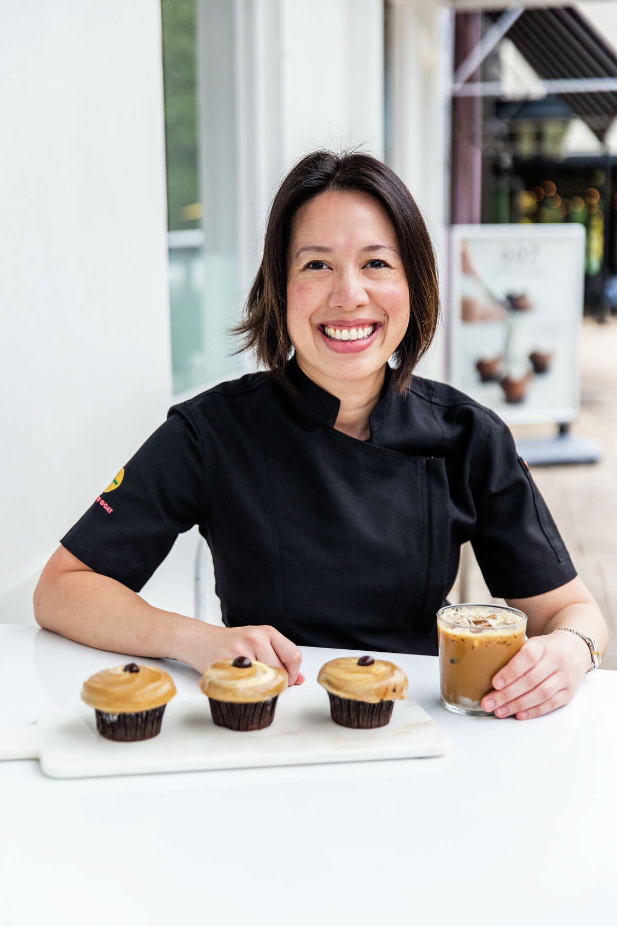 Christine Ha of The Blind Goat and Xin Chao poses with her signature cupcake as part of CRAVE's limited edition "Hush Hush" series.