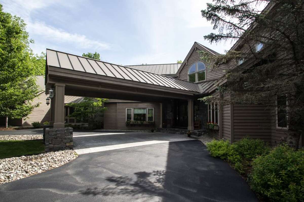 Built in 2004, this week's selection is a huge stunner. With over 11,000 square feet of living space, five bedrooms, five full bathrooms, and two powder rooms, let's dive into some of the features you won't find in most other homes for sale in the area: An indoor-outdoor saltwater swimming pool. A detached garage with horse stalls (and over 60 acres of land to accommodate said horses). Cherry wood floors and library furnished in cherry wood. An outdoor kitchen and poolside bar for entertaining. Floor-to-ceiling windows, evident from the unique facade of the house, in the living room to take in the views. Vaulted ceilings add to the space and an elevator aids accessibility. Calm water schools. Estimated taxes: $25,023.71. Listing price: $2.45 million. Contact Harold Reiser, Julie & Co. Realty, 518-588-5224, harold@juliecorealty.com.
