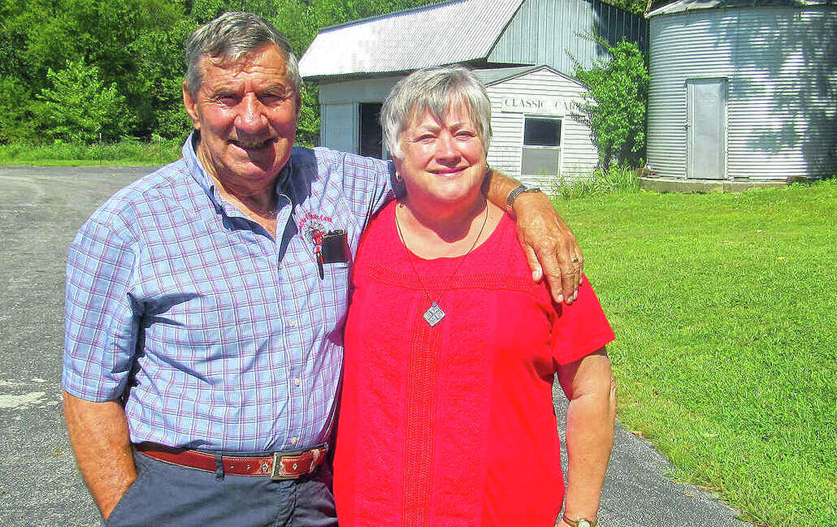 Russ and Anita Noel on their farm, where they started selling classic cars in the mid-1990s. The couple opened Country Classic Cars in Staunton in May 1999 and has sold the business.