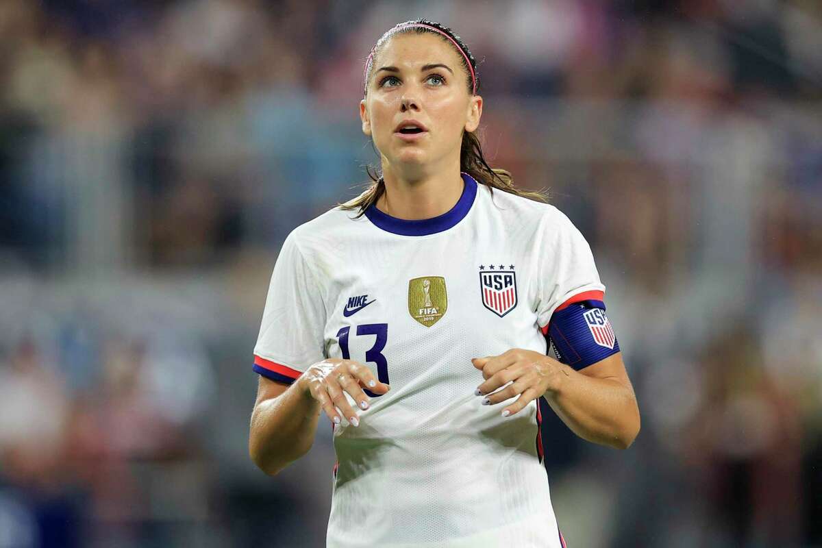 United States forward Alex Morgan (13) plays the field during an international friendly soccer match against Paraguay, Tuesday, Sept. 21, 2021, in Cincinnati. The United States won 8-0. (AP Photo/Aaron Doster)