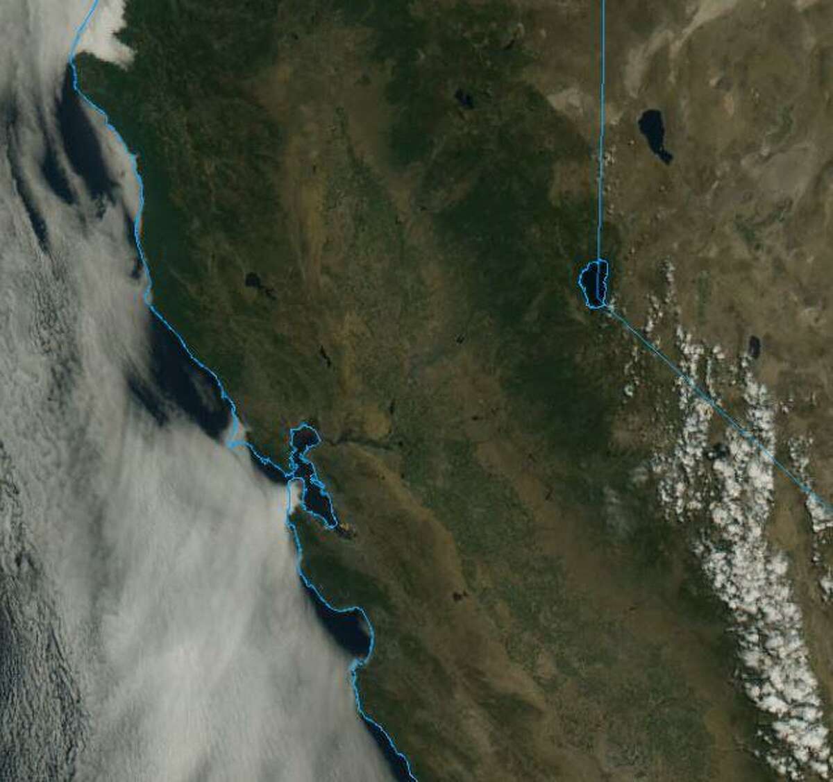 Friday morning satellite imagery shows a patch of fog shielding San Francisco from the scorching hot weather in the rest of the Golden State.