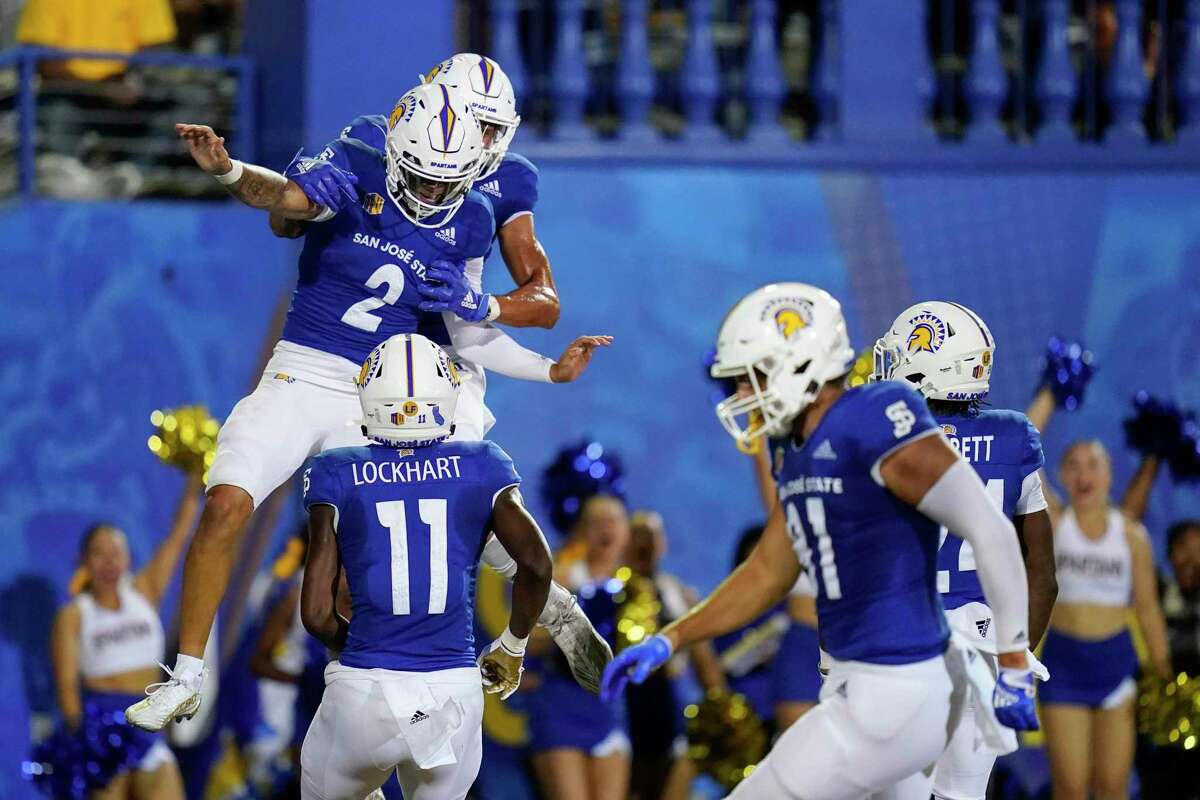San Jose State quarterback Chevan Cordeiro (2) celebrates with teammates after his 32-yard touchdown run against Portland State during the first half of an NCAA college football game in San Jose, Calif., Thursday, Sept. 1, 2022. (AP Photo/Godofredo A. Vásquez)