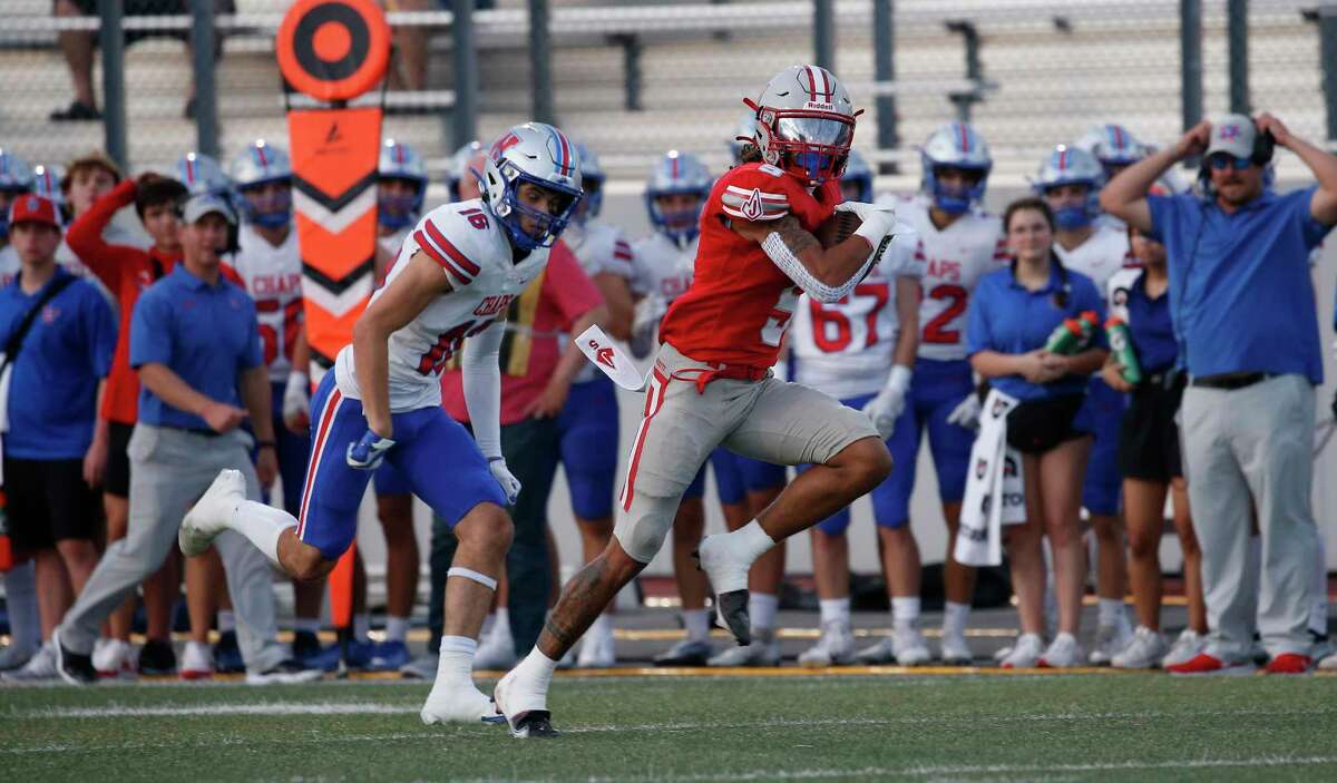 Judson wide receiver Anthony Evans (5) outruns Austin Westlake defensive back Will Courtney (16) for his 77 yard touchdown on Friday, Sept.2, 2022 at Rutledge Stadium. Halftime score Austin Westlake 37-Judson 7