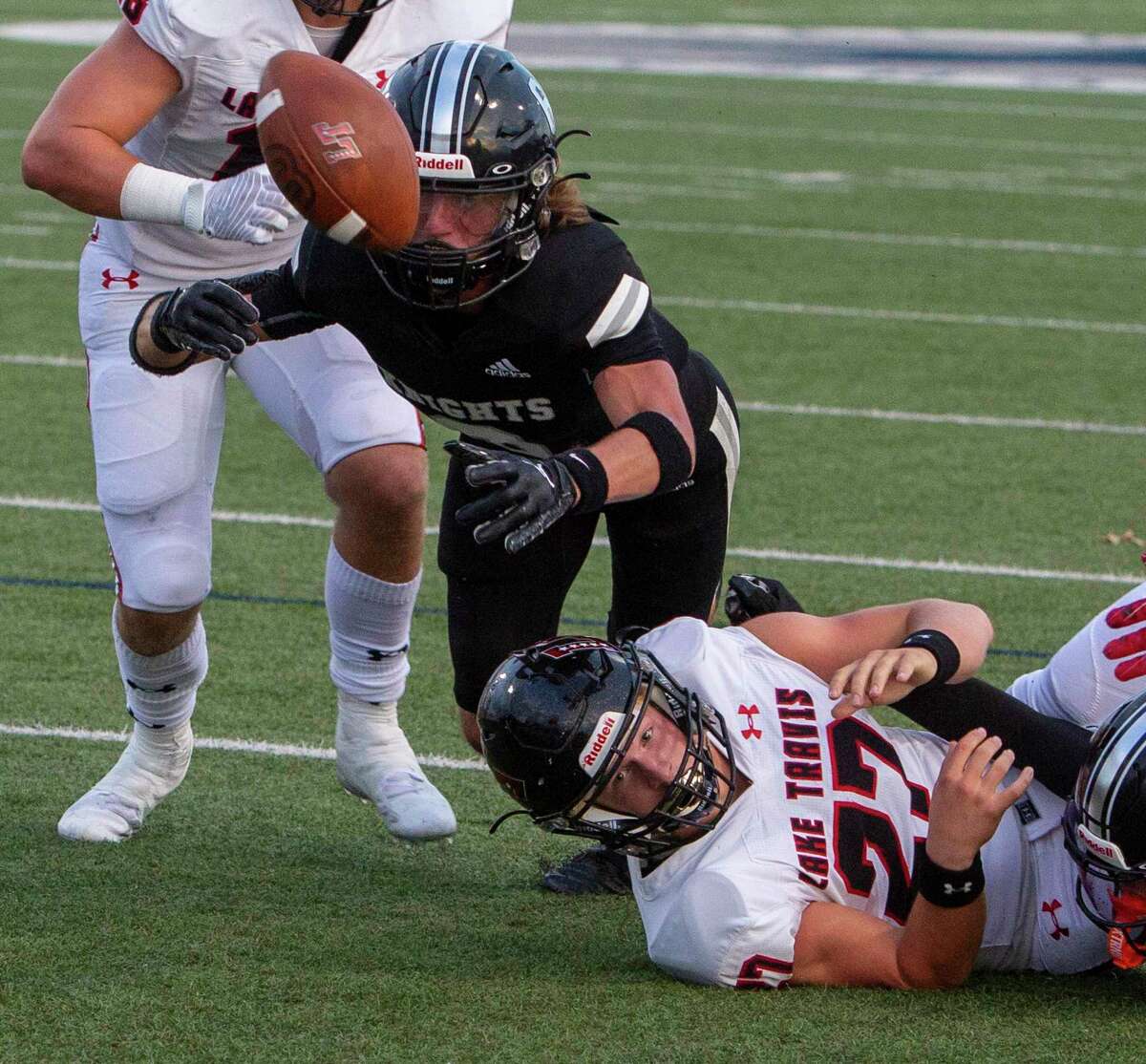 Steele’s Connor Vincent reaches for a fumble by Lake Travis’s Sam Self Friday night, Sept. 2, 2022 in at Lehnhoff Stadium. Vincent recovered the loose ball in the end zone for a touchback.