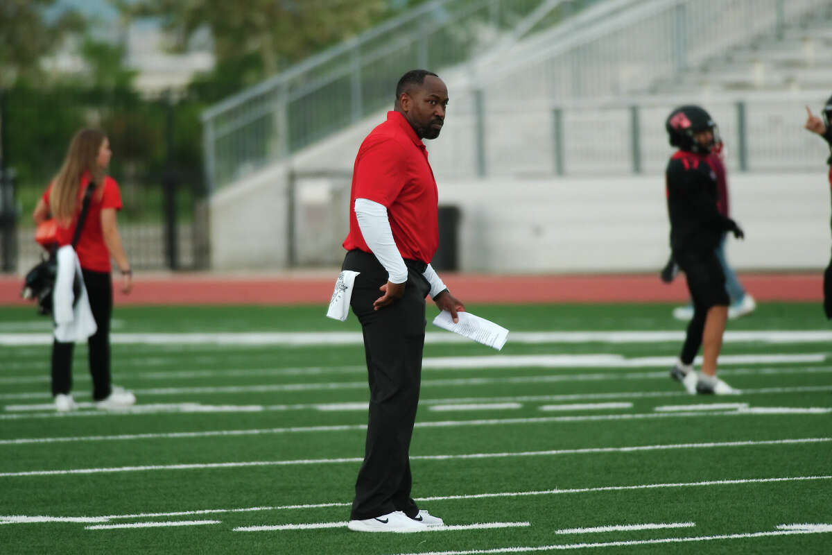 Clear Brook football coach Patrick Sanders watches as the team warms up before the game against Baytown Lee Friday, Sep. 2, 2022 at CCISD Challenger Columbia Stadium.
