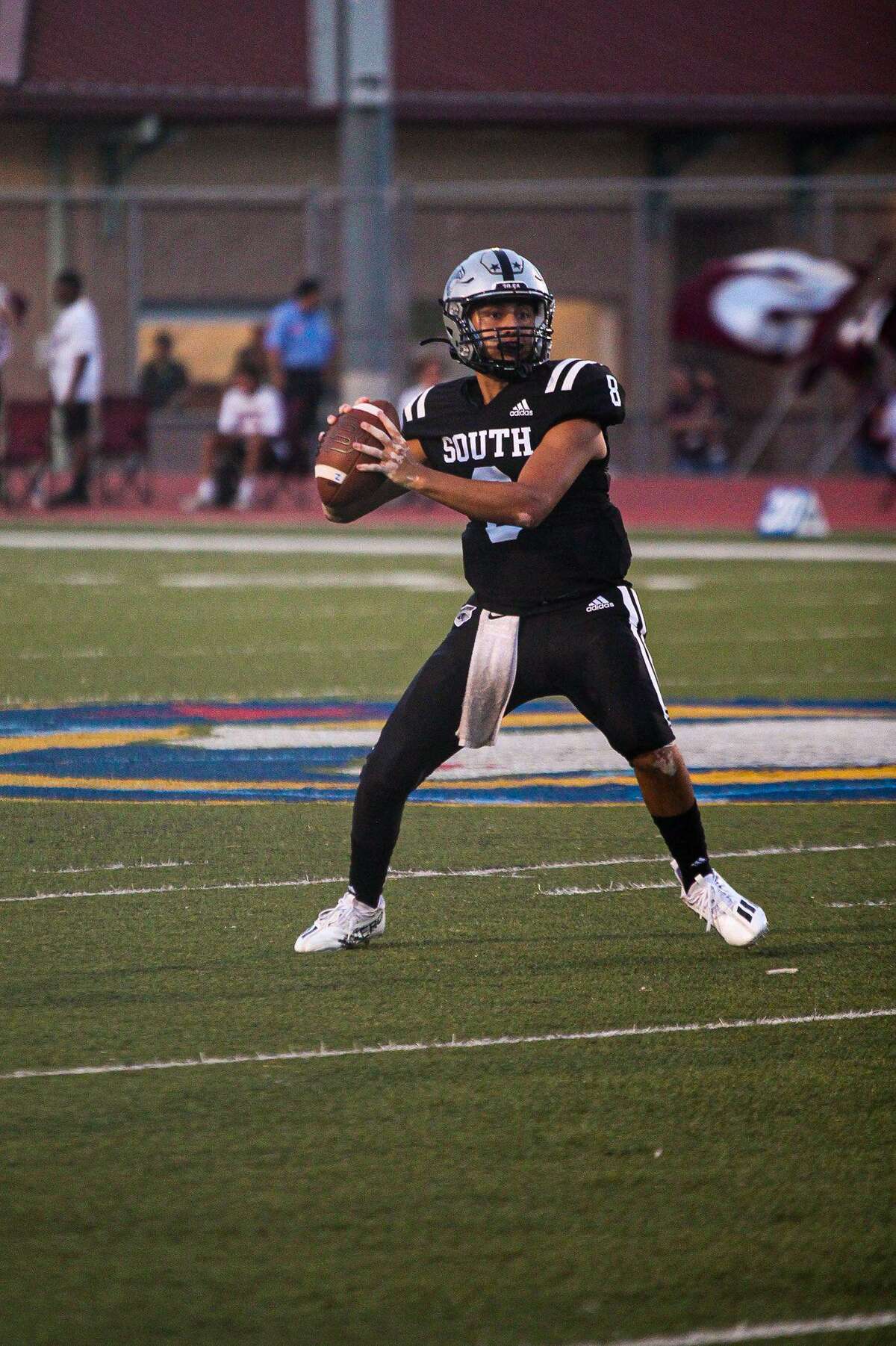 United South quarterback Luis Cisneros drops back for a pass during a game against Flour Bluff on September 2, 2022 at the Bill Johnson Student Activity Complex.