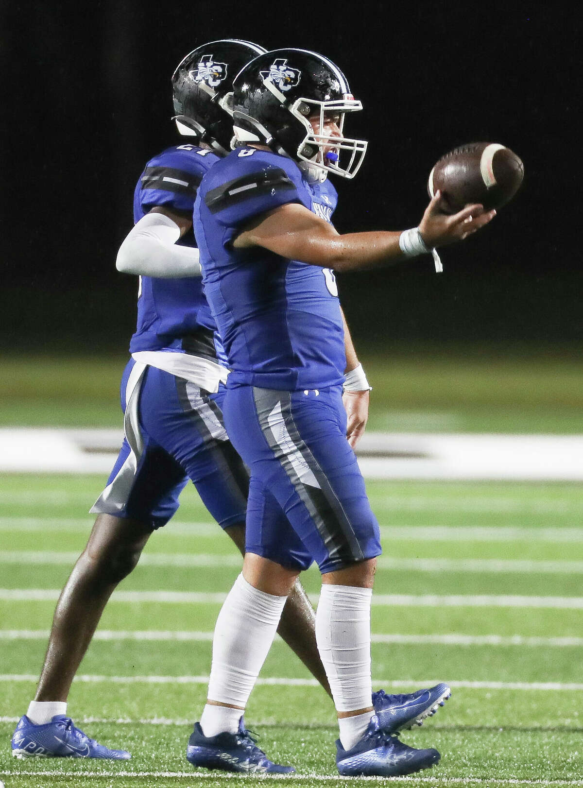 New Caney linebacker Trayce Baker (8) tosses the ball up in the air after recovering a Porter fumble in the second quarter of a non-district high school football game at Randall Reed Stadium, Friday, Sept. 2, 2022, in New Caney.
