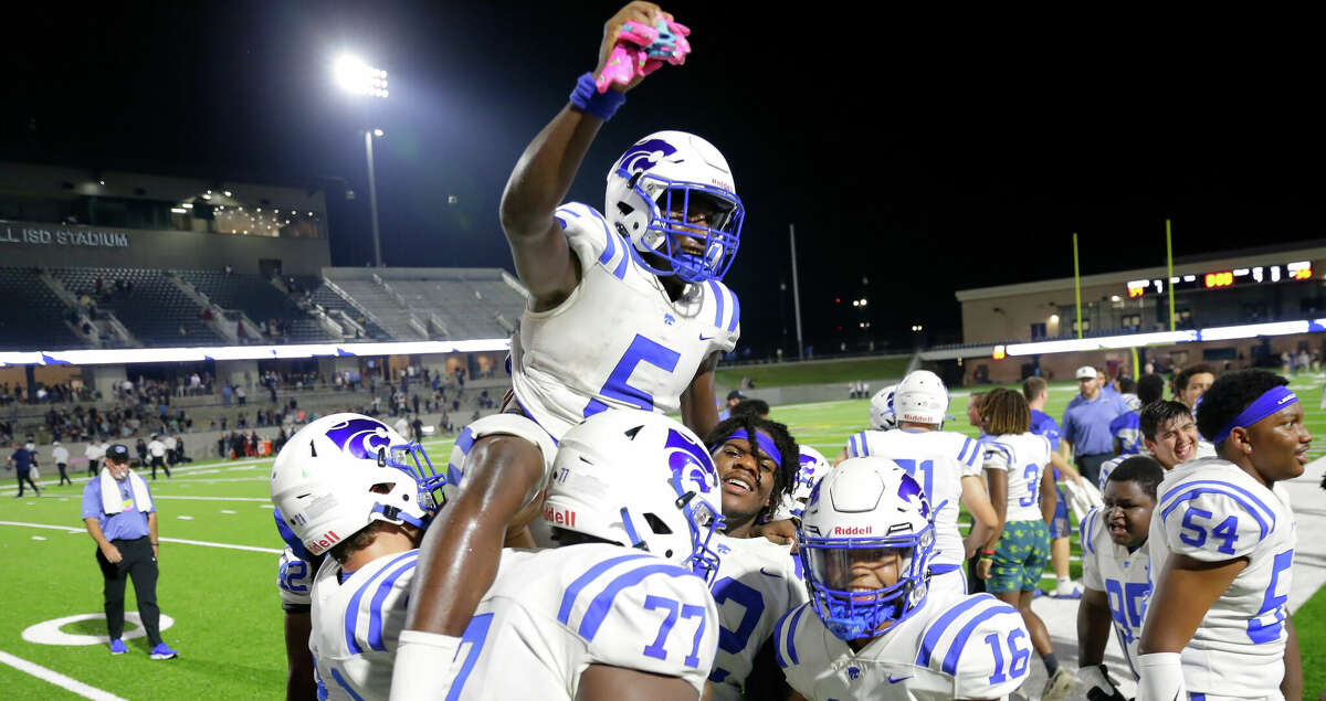 Cypress Creek's Jamon Richardson is lifted up by teammates after their 56-54 win over Tomball Memorial on the touchdown reception by Richardson as the clock ran out in the second half of a high school football game Friday, Sep. 2, 2022 in Tomball, TX.