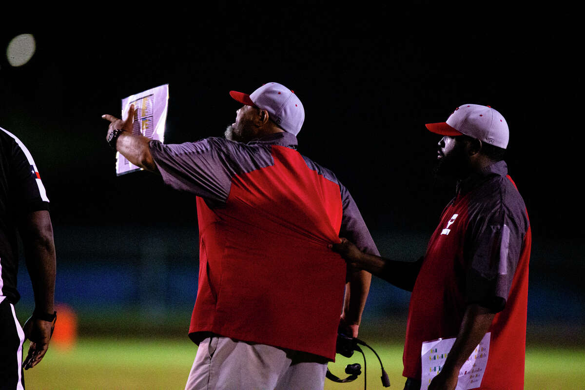 Furr Brahmans head coach Cornell reacts talking to the referee is hold back by his assistant in the second half of action during a High school football non-district game between Brookshire Royal vs Furr at Cowart Stadium in Houston, TX, September 02, 2022. Royal Falcons defeated Furr Brahmans 30-12.