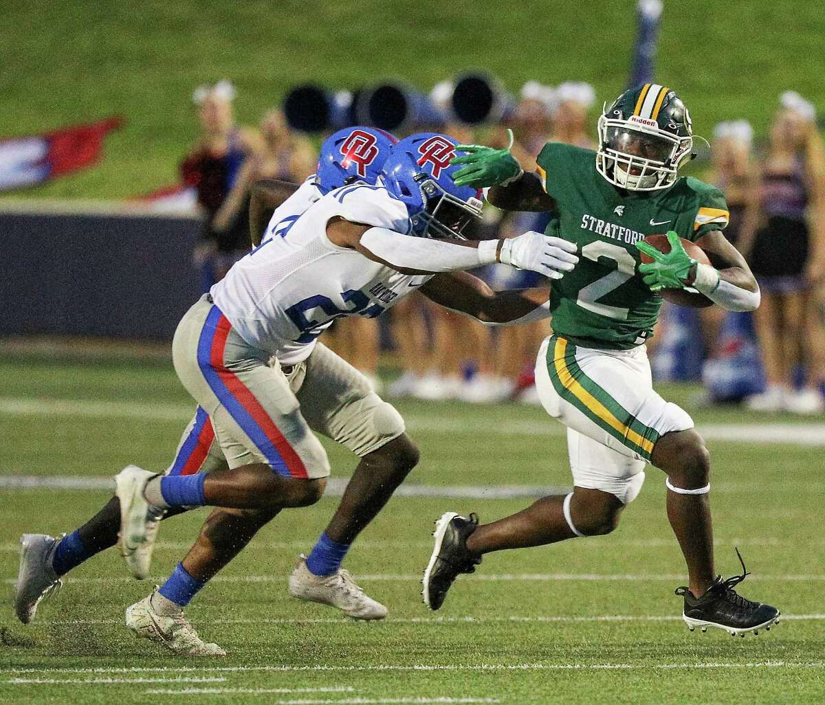 Stratford running back Dallas Payne (2) rushes two Oak Ridge defenders during a high school football game between Oak Ridge and Stratford on September 2, 2022 at Tully Stadium in Houston , Texas. (Photo by Bob Levey/Contributor)
