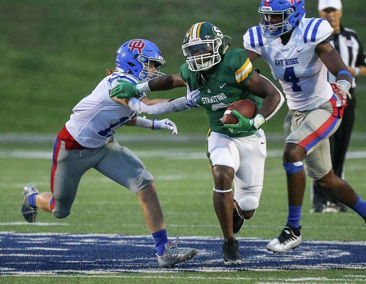 Stratford running back Dallas Payne (2) rushes two Oak Ridge defenders during a high school football game between Oak Ridge and Stratford on September 2, 2022 at Tully Stadium in Houston , Texas. (Photo by Bob Levey/Contributor)