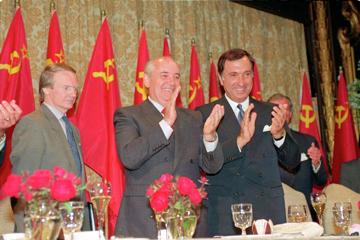 Soviet President Mikhail Gorbachev (center) and San Francisco Mayor Art Agnos applaud at a luncheon with U.S. business leaders in June 1990 in San Francisco. Gorbachev later based his foundation in the city.