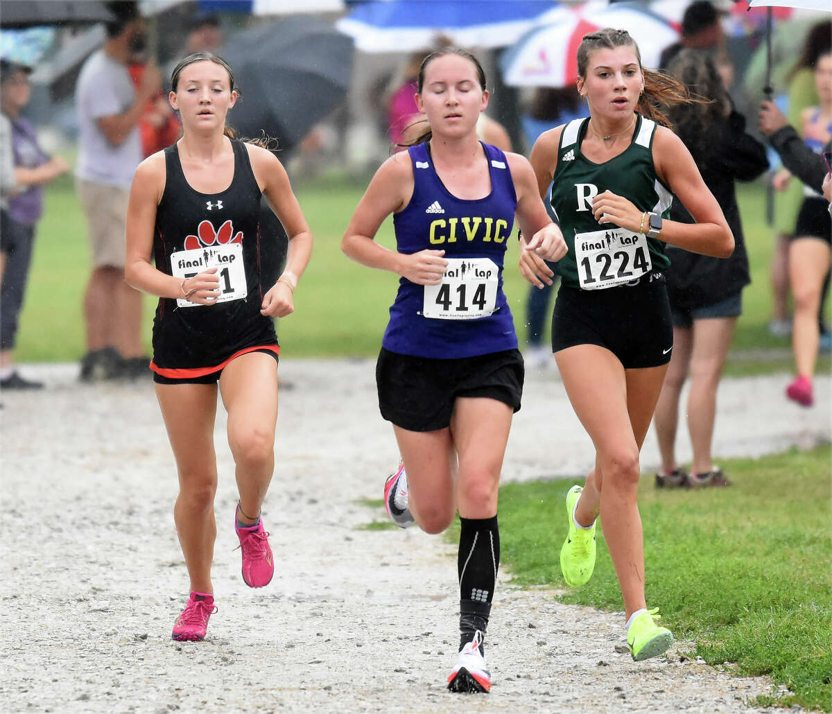 Edwardsville's Emily Nuttall, left, runs with Civic Memorial's Hannah Meiser, center, and Rock Bridge's Mae Walker in the 49th Granite City High School Robinson/Lang Cross Country Invitational on Saturday inside Wilson Park.