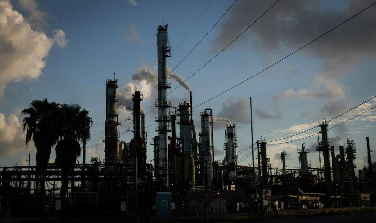 The sun rises over a petrochemical facility Wednesday, July 27, 2022, along TX-197 in Texas City.