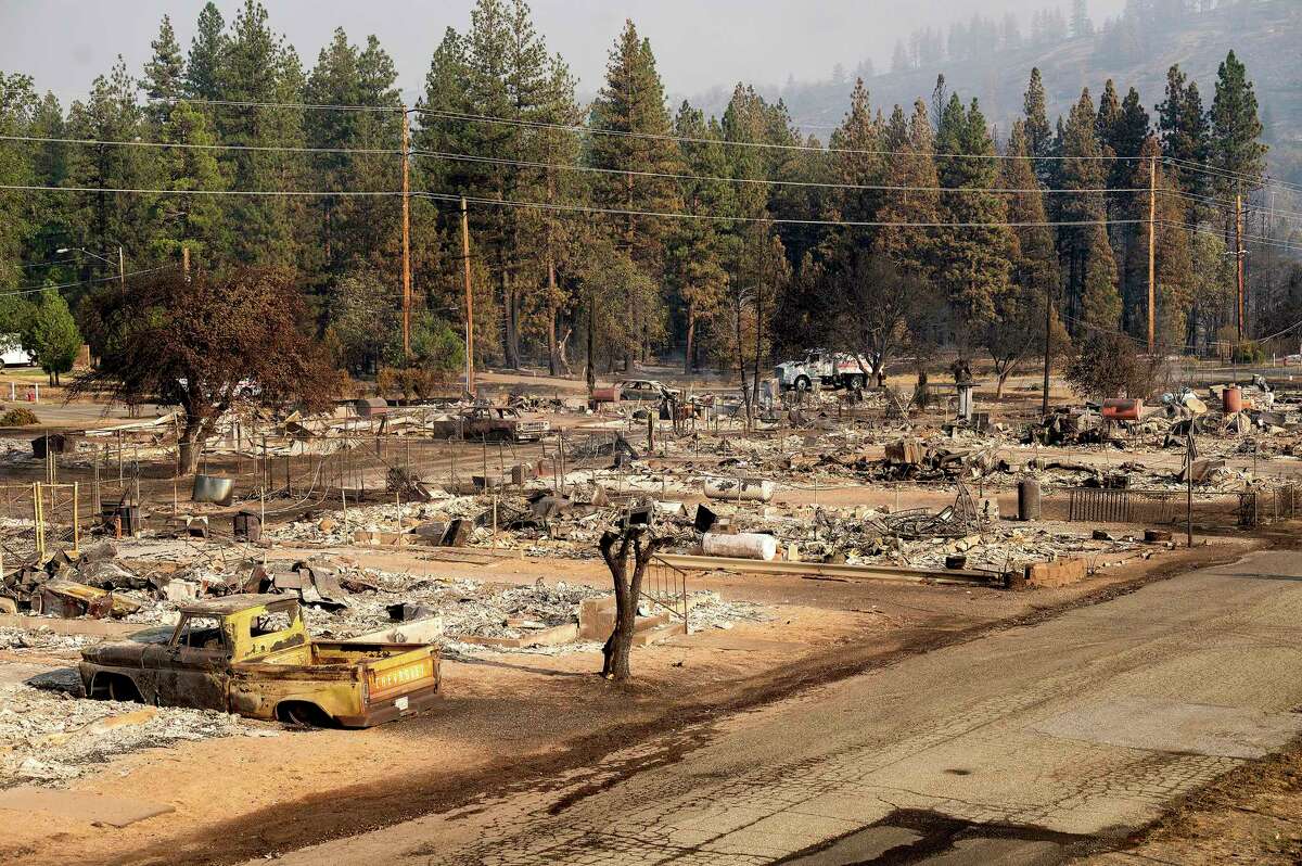 Homes destroyed by the Mill Fire line Wakefield Ave. on Saturday, Sept. 3, 2022, in Weed, Calif.