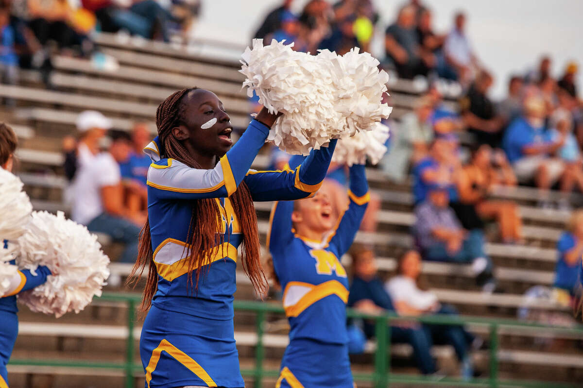 Midland High School sophomore Faith Kogei cheers on her school's football team on Sept. 2, 2022 in Mount Pleasant.
