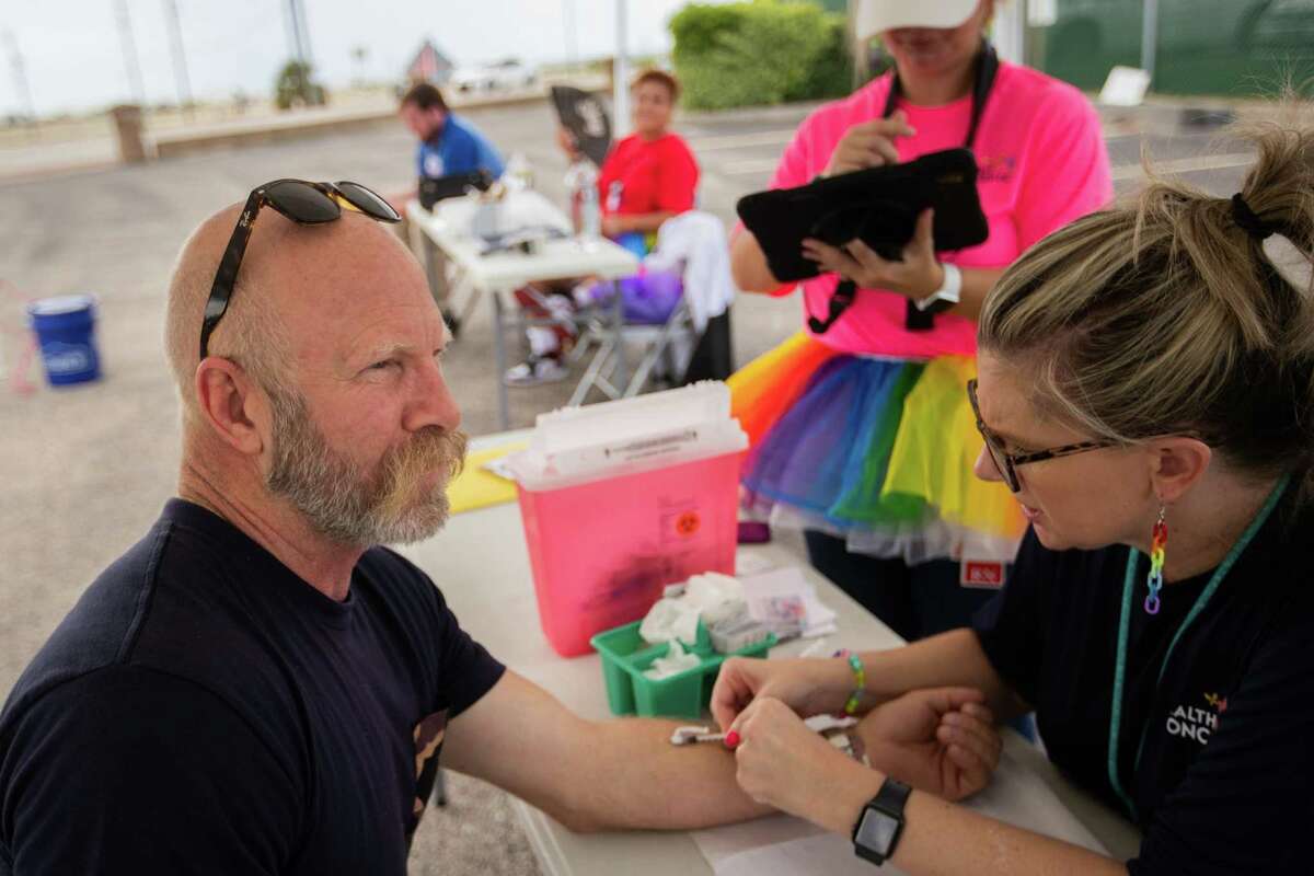 A person gets inoculated with a vaccine to prevent Monkeypox at a Galveston County Health District mobile clinic, Saturday, Sept. 3, 2022, in Galveston. The Monkeypox were free and walk-ins were welcomed.