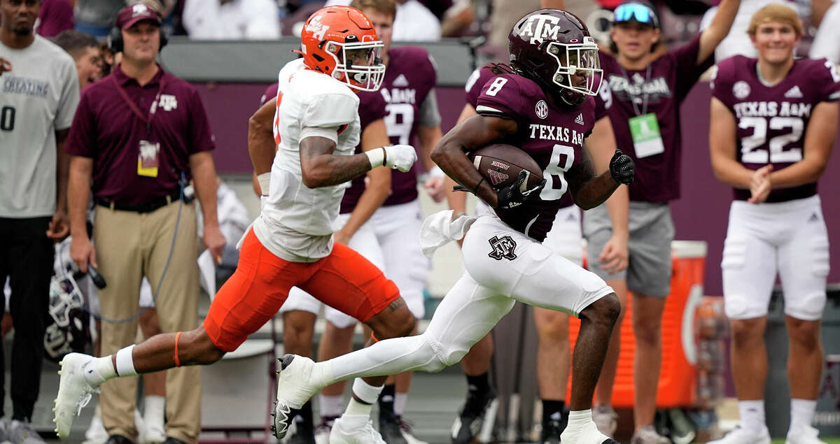 Texas A&M wide receiver Yulkeith Brown (8) breaks away from Sam Houston State defensive back Da'Veawn Armstead after catching a pass to score a 66-yard touchdown during the first half of an NCAA college football game Saturday, Sept. 3, 2022, in College Station, Texas. (AP Photo/David J. Phillip)
