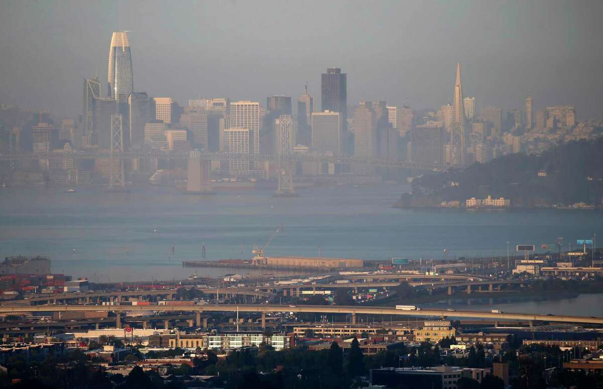 The San Francisco skyline is visible through a layer of smog at sunrise during an earlier period of air pollution in 2019.